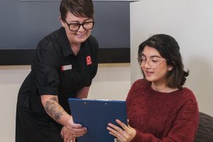 Receptionist at Central Queensland Radiology answering a patients frequently asked questions