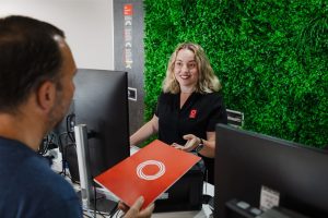 Central Queensland Radiology team member hands over GP Guide to Medicare