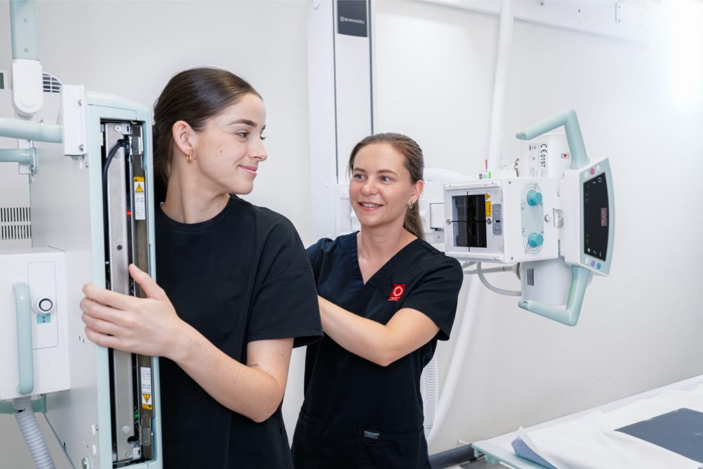Radiographer positions patient for X-ray at Central Queensland Radiology